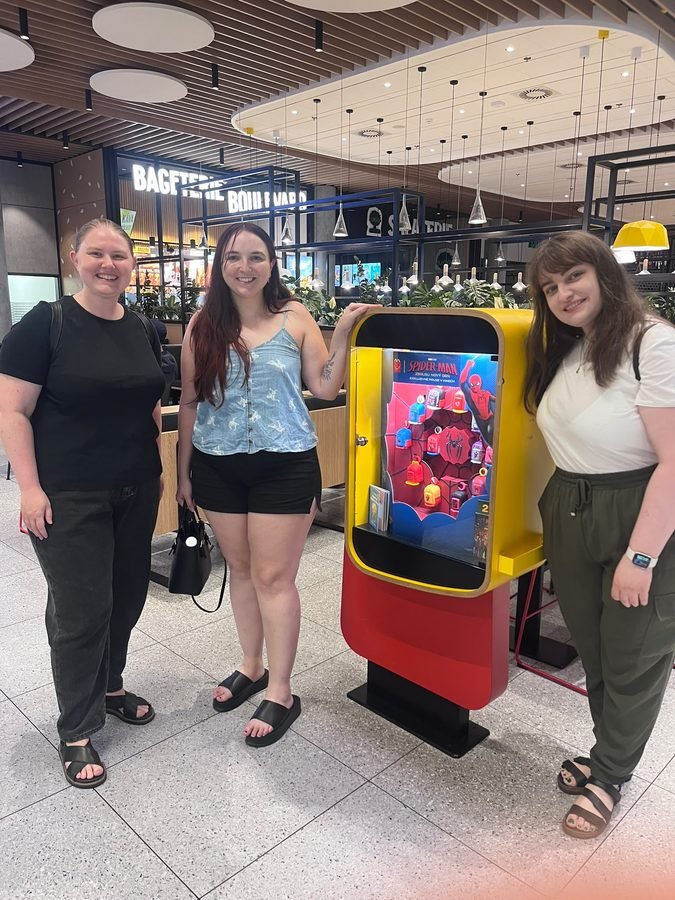 Kino Klub members at a shopping centre movie display