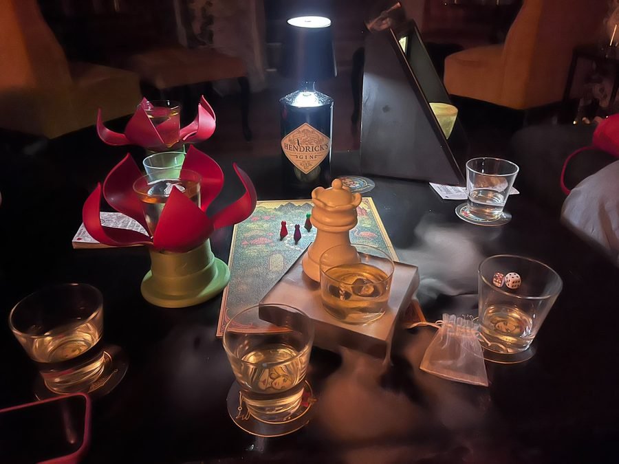 Board game and drinks set up during a Kino Klub game night