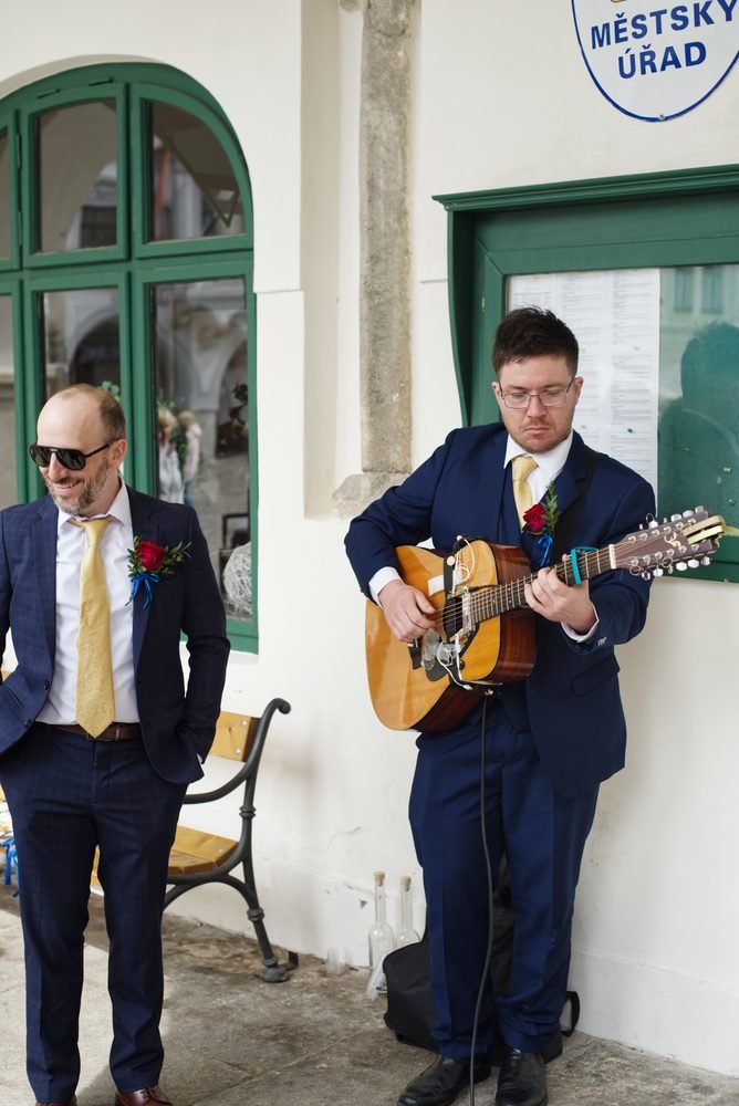 Groomsmen outside the Prague town hall before the ceremony